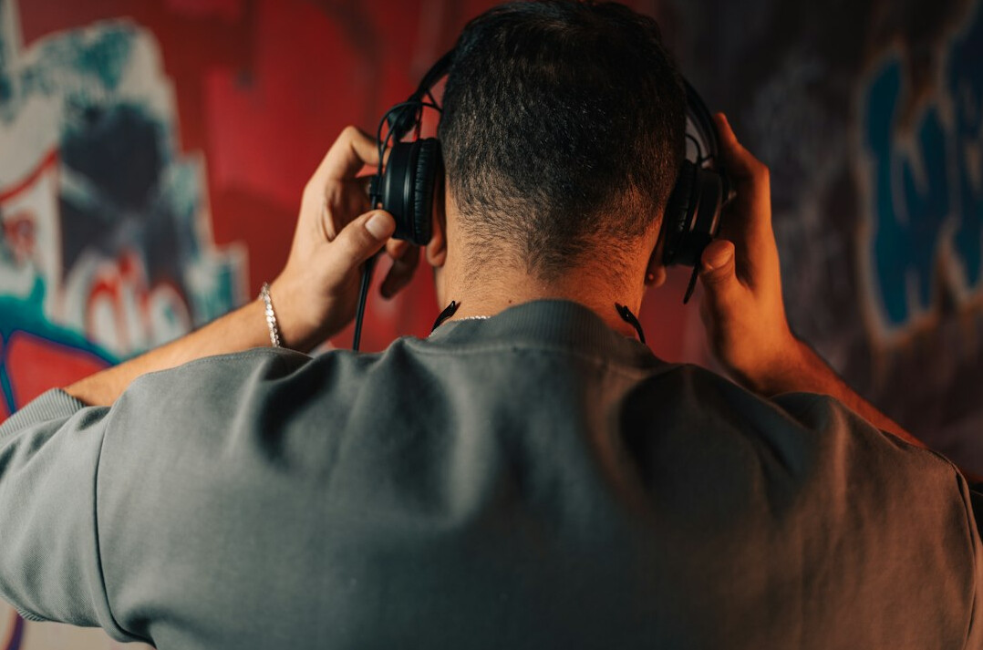 Podcast host recording an episode with headphones